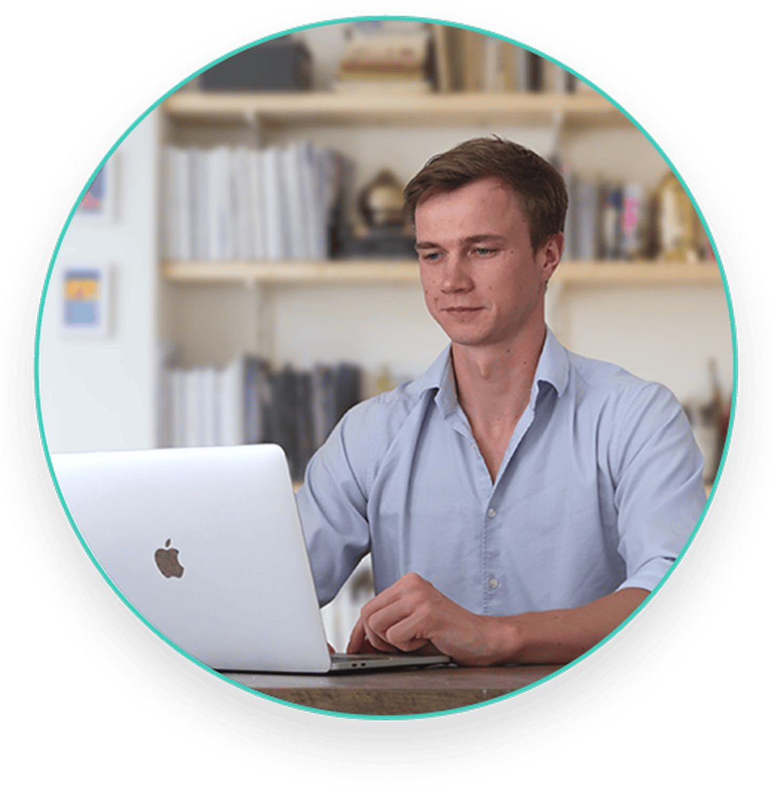 About Us Ugis Balmaks sitting in front of laptop